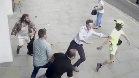 Spencer Duarte being tackled off his e-bike by members of the public after he stole a phone from a victim's hand
