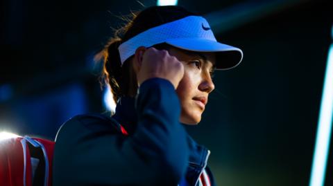 Emma Raducanu waits to walk on court at Indian Wells