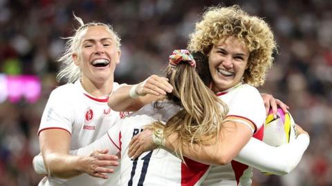 England players celebrate during their opening win over USA