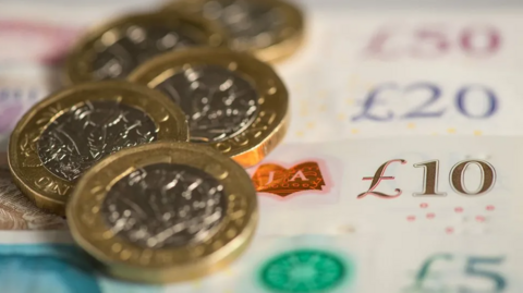 Picture of pound coins and notes of various denominations