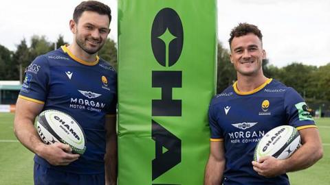 Matt Rogerson, left, and Will Trewin of Worcester Warriors pose with rugby balls 