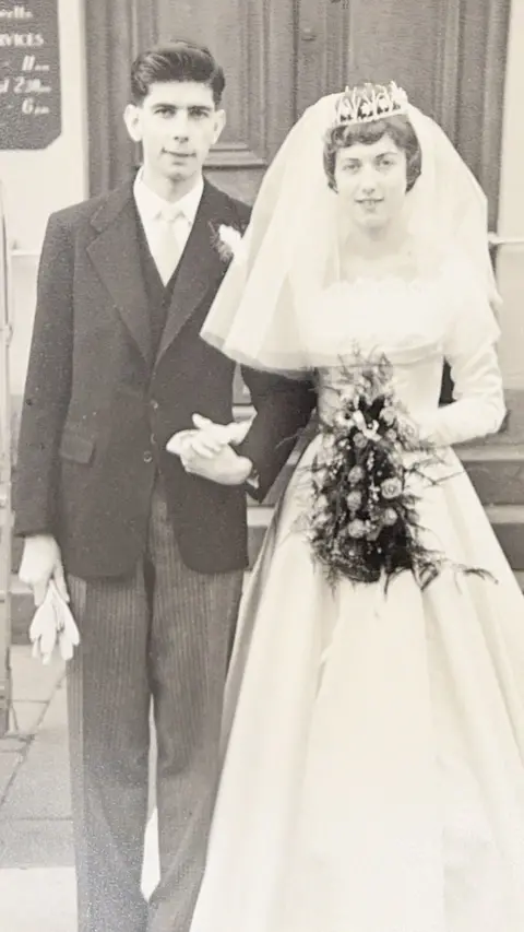 A black and white image of a married couple