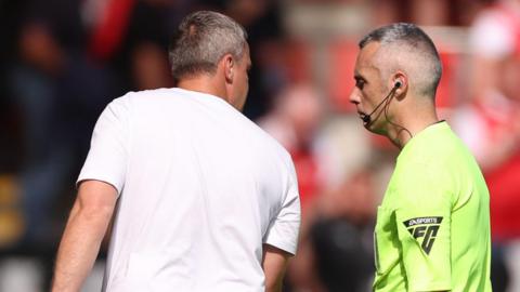 Michael Duff argues with referee Sebastian Stockbridge after Huddersfield's defeat at Rotherham