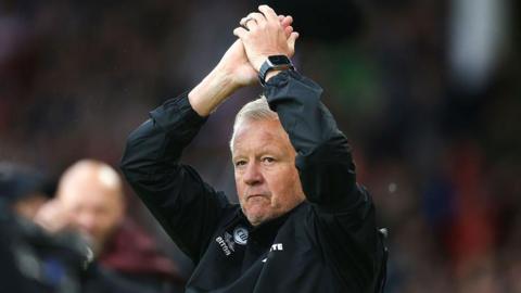 Sheffield United manager Chris Wilder applauds fans before his first game back in charge of the club