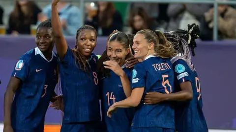 France players celebrate scoring against Wales