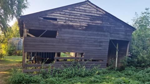Wooden panels torn away from a barn at the 2nd Beeston Sea Scouts water base at Barton Island in Nottingham.