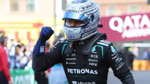 Kimi Antonelli clenches his fist in celebration after taking pole for position for the Monaco Grand Prix