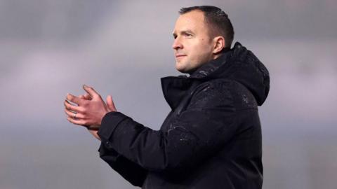 Close up of Birmingham City boss Chris Davies clapping the fans after a game