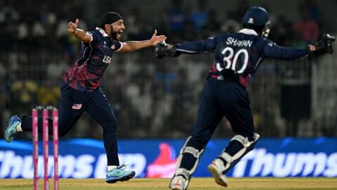 USA's Harmeet Singh spreads his arms out in celebration of taking his seventh wicket of the 2026 T20 World Cup