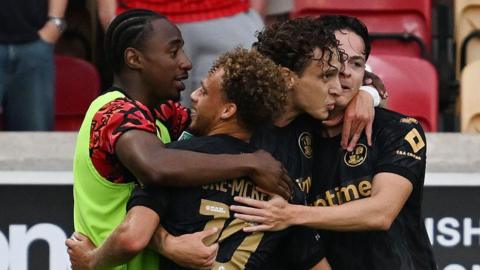 Crawley players celebrate scoring