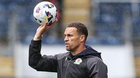 Blackburn Rovers manager Valerien Ismael prepares to throw the ball during the game against Norwich City