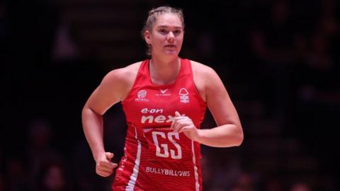 Rolene Streutker running onto court