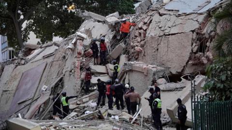 Rescuers in rubble