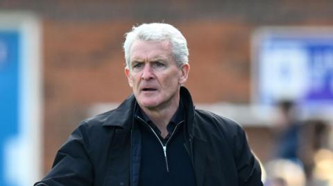 Mark Hughes issuing instructions during Carlisle's game with Wimbledon