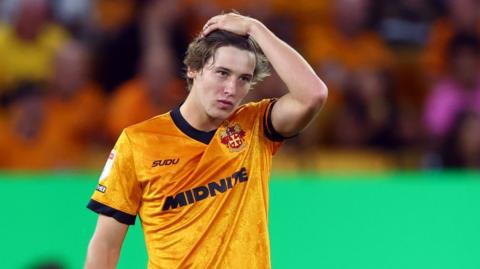 Fer López of Wolverhampton Wanderers shows a look of dejection after conceding the second goal