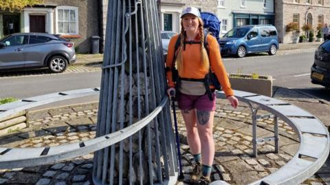 Sarah Curran at the start of the Cumbria Way at The Gill in Ulverston