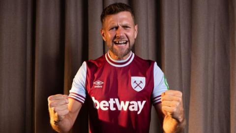 Niclas Fullkrug wearing a West Ham shirt