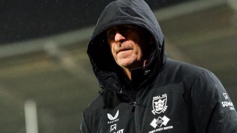 Hull FC head coach John Cartwright in a club issued coat