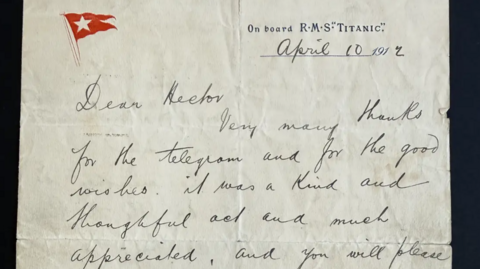 Old style hand-writing on a parchment piece  with 'RMS Titanic' on the top