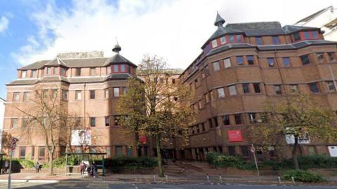 Cardiff Sixth Form College is a red brick building with trees outside