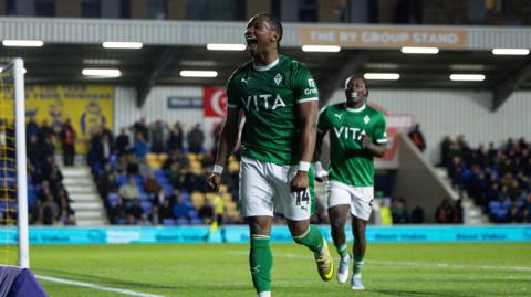 Tayo Edun celebrates his goal for Stockport County against AFC Wimbledon