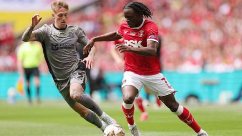 Ethan Galbraith of Leyton Orient battles for the ball with Charlton Athletic's Tyreece Campbell