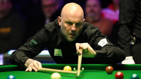 Mark King playing snooker
