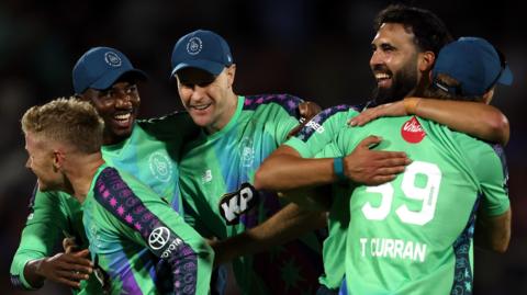 Oval Invincibles players celebrate victory in The Hundred