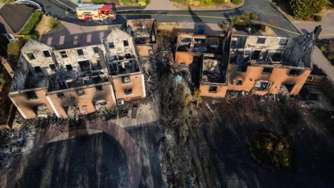 A drone view of burnt-out houses