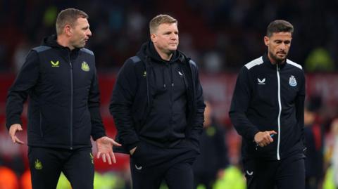 Eddie Howe and coaching staff look dejected