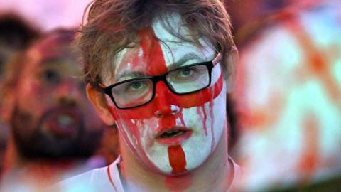 Football fans react as they watch England v Argentina in their semi-final match in the FIFA World Cup 2026 at Freight Island on July 15, 2026 in Manchester, England.