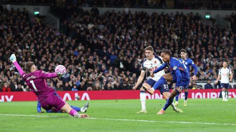Joao Pedro of Chelsea scores the opening goal against Tottenham