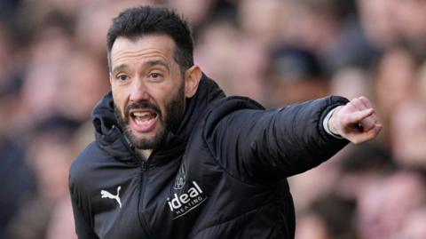 Carlos Corberan shouts instructions during a West Brom game