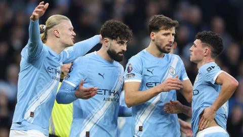 Man City players celebrate