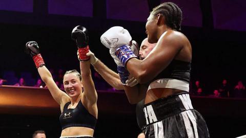 Jade Jones' arm is lifted as the winner of the boxing bout against Egypt Criss 