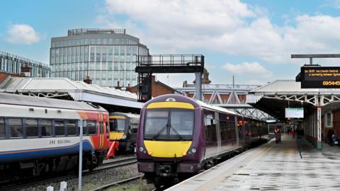 Two regional trains waiting at platforms at Nottingham station