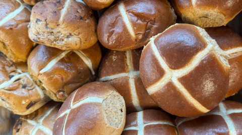 A close-up of hot cross buns
