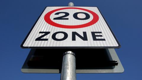 A 20mp/h speed zone sign