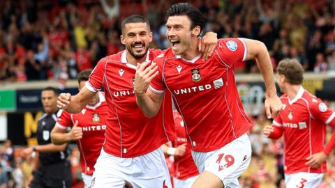Wrexham summer signings Conor Coady (left) and Kieffer Moore (right) celebrate goal 