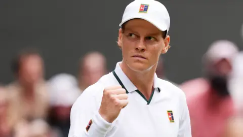 Jannik Sinner celebrates with a clenched fist