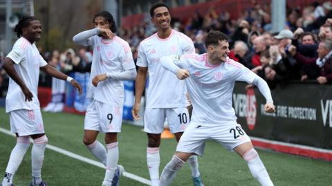 Macclesfield celebrate scoring against Slough Town in extra time