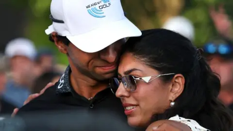 Aaron Rai in an embrace with wife Gaurika Bishnoi Rai