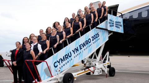 Wales players and boss Rhian Wilkinson on the plane