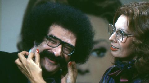 Journalist Gene Shalit smiles as actor Sophia Loren pulls his moustache on the 'Today Show' set at NBC Studios.