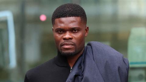 Former Arsenal player Thomas Partey, who has been charged with five counts of rape and one count of sexual assault, walks outside Westminster Magistrates' Court, in London, Britain, August 5, 2025