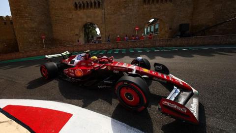 Lewis Hamilton drives in front of the Baku castle
