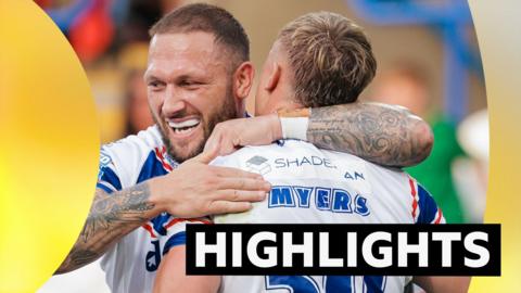 Jayden Myers of Wakefield celebrates with Josh Griffin after scoring a try