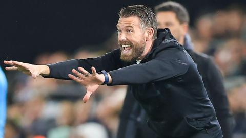 Luton manager Rob Edwards shouting instructions at his players