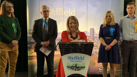 Labour's Marie Tidball celebrates her victory as defeated Penistone and Stocksbridge candidate Miriam Cates looks on