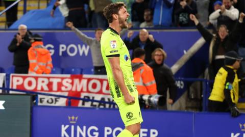 John Swift celebrates in front of the Portsmouth fans